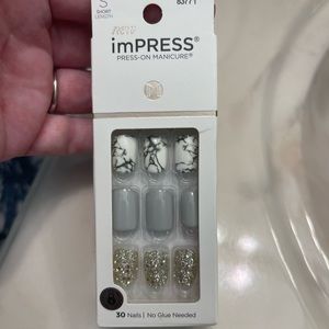 Unopened impress press on nails.  Set of 30 nails that have the sticky tabs.